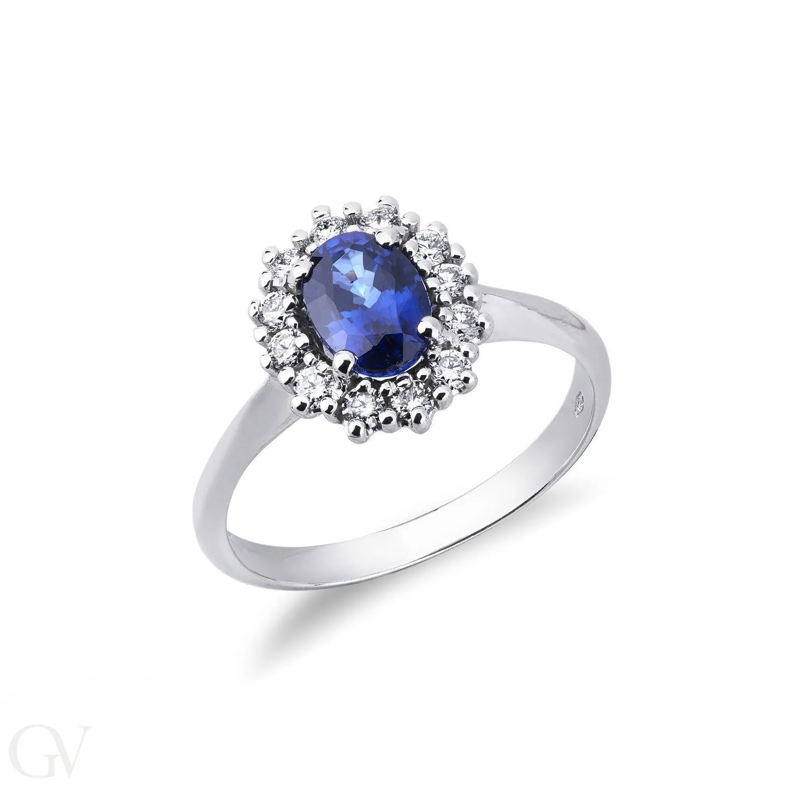 Anello modello a contorno in oro bianco 18k con Zaffiro blu e diamanti