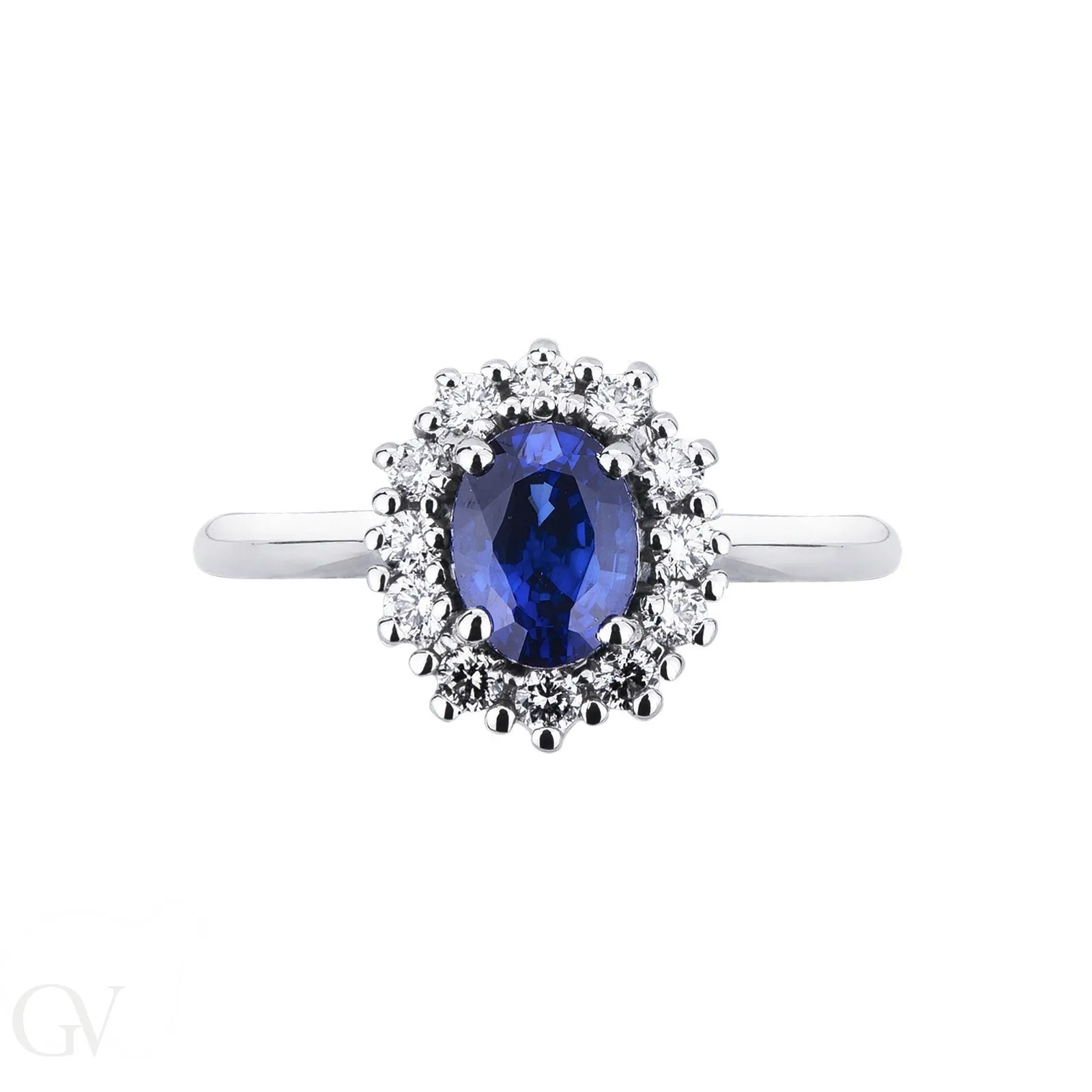 Anello modello a contorno in oro bianco 18k con Zaffiro blu e diamanti